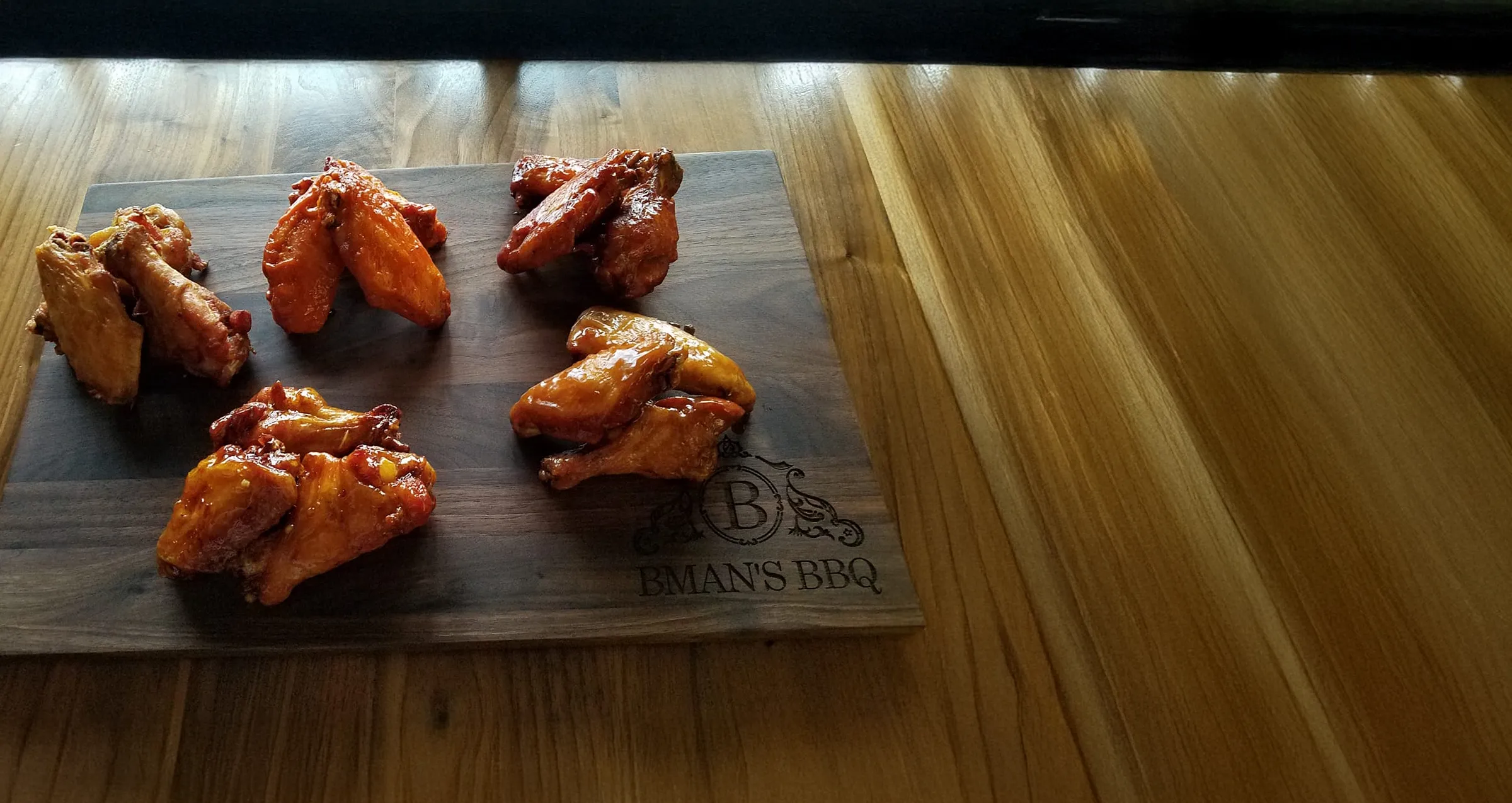 BMAN's BBQ downtown Castle Rock - smoked wings on table - 5 flavors
